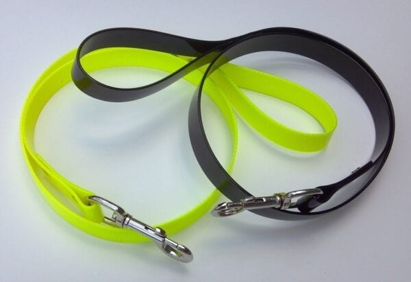 A yellow and a black leash with handles