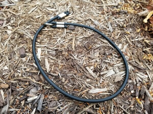 A black leash on the ground