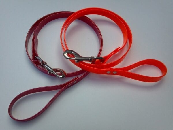 An orange and red leash with handles